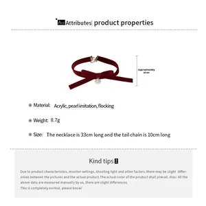 Detail view of burgundy velvet bow necklace showing length 33+10cm and weight 8.7g specs