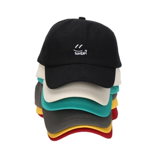 Stacked outdoor cotton baseball caps with smile embroidery in black, beige and green
