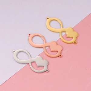 Three metal infinity heart charms in gold, rose gold, and silver finishes on background