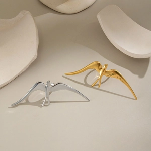Minimalist gold and silver swallow bird rings crafted in polished stainless steel for women