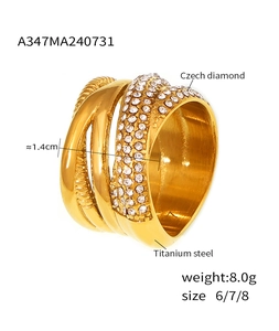 Macro detail of 18k gold plated titanium steel braided ring with multi-row Czech diamonds