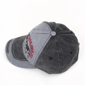 Detail of washed denim baseball cap featuring New York embroidery and decorative stitching