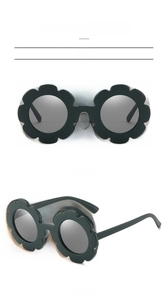 Deep green sunflower shape kids sunglasses with matte finish and dark protective lenses