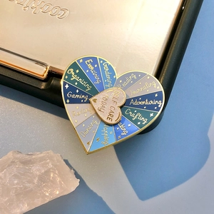 Rainbow heart enamel pin with rotating wheel featuring Self Care Today activities