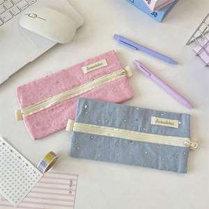 Pink and blue star pattern canvas pencil cases shown with stationery on a desk