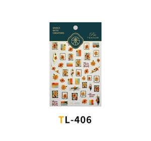 Close-up of sunflower nail stickers with gold accents and green packaging card