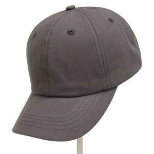 Detail view of charcoal gray kids baseball cap featuring breathable eyelets and visor stitching