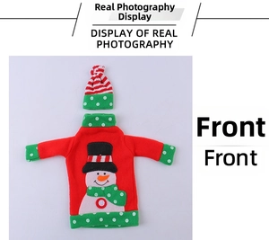 Detailed front view of a red knit snowman wine bottle cover with matching striped hat