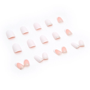 Oval press-on nails set with minimalist pink base and silver glitter gradient tips