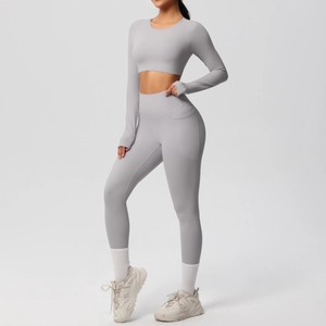 Detail view of high waist yoga leggings with side pocket and long sleeve crop top