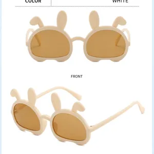 Milk white foldable bear-ear sunglasses for kids with UV protection shown in front and side views