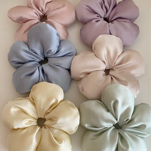 Set of 6 satin flower hair scrunchies in pastel colors with silky texture and soft sheen