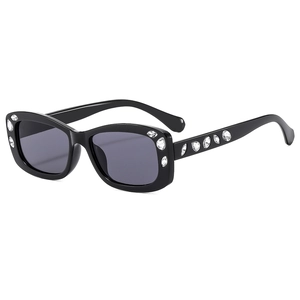 Elegant square sunglasses with black frame and crystal rhinestones on a white background