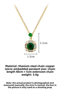 Detailed view of emerald cut green gemstone pendant with micro-pave crystals on gold chain