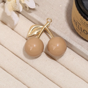DIY cherry pendant with gold leaves and brown resin balls for necklaces and keychains