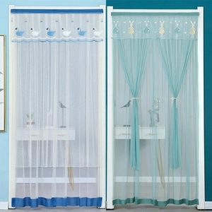 Close-up of modern linen mesh door curtains featuring swan and rabbit embroidery detail