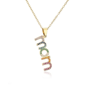 Gold MOM pendant necklace with colorful zircons on a white background with reflection
