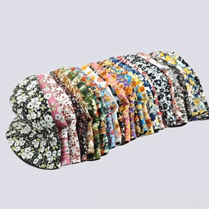 Multiple digital floral print bucket hats in various patterns like sunflower and botanicals