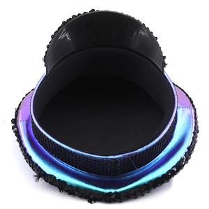 Detail of purple iridescent sequins and rhinestone crown on festival military captain hat
