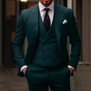 Three-piece dark green men's suit featuring a blazer, double-breasted vest, and trousers