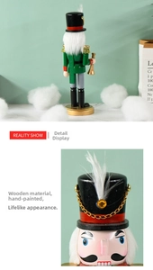 Detail of hand-painted wooden 25cm green nutcracker soldier with white feathers