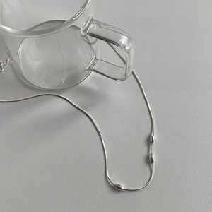 Minimalist s925 silver snake chain necklace with three olive beads in a clean setting