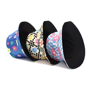 Women's reversible sun bucket hats with colorful floral and checkerboard prints