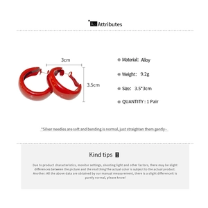 Detail view of red enamel geometric hoop earrings with 3.5cm size and silver pins