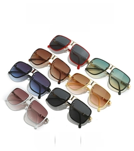 Close-up of retro double-bridge square sunglasses in various colors and gradient lenses