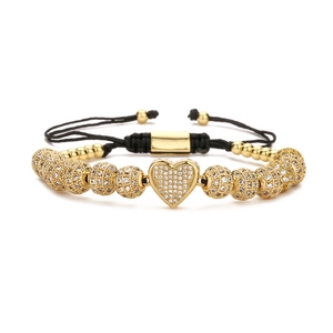 Adjustable black braided rope bracelet with gold metal beads and micro-pave heart zircon