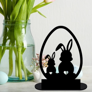 Detail of black acrylic Easter bunny silhouette stand with heart cutout on table