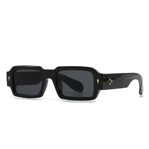 Classic square black sunglasses with iconic gold arrow rivets and grey lenses