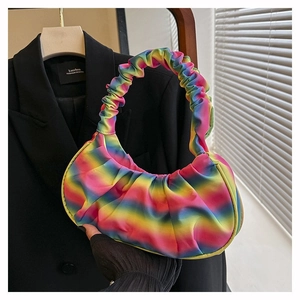 Detail of colorful rainbow gradient pleated hobo bag with satin texture handle