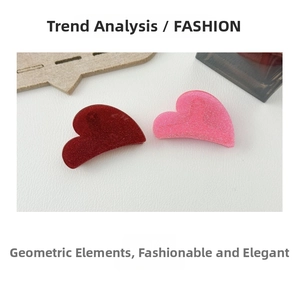 Detailed view of heart-shaped glitter hair claws in dark red and soft pink finishes