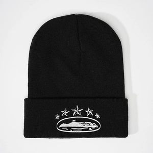 Black knit beanie with white embroidered stars and mountain design in Y2K street style