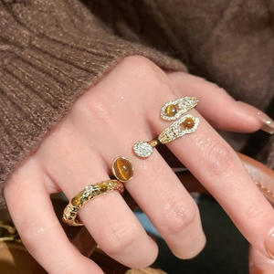 18K gold plated tiger eye ring set with zircon micro-paving on a model hand