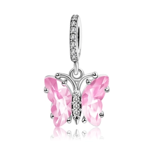Detailed close-up of a silver butterfly charm with pink gemstones and clear crystals