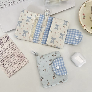 Floral fabric card wallet interior showing zipper coin pocket and multiple card slots