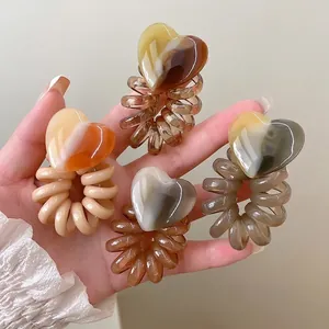 Minimalist heart phone cord hair ties set in earth tones for stylish ponytails