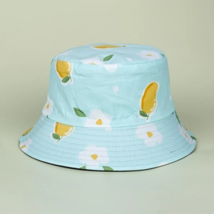 Close-up of mint green sun hat with yellow mango and white flower print patterns