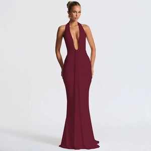 Detail of elegant burgundy maxi dress with deep V-neck, neck tie and gathered waist design