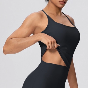 Close-up of black racerback yoga tank top showing elastic fabric texture and stitching