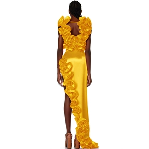 Back view of bright yellow satin dress with ruffles and asymmetric high slit design