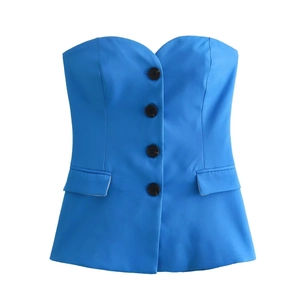 Detail of royal blue tube vest with four black buttons and faux flap pockets