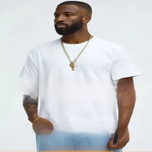 Detailed view of heavy cotton white T-shirt with stylish layered gold necklaces