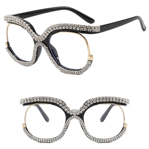 Black oversized frames with double row crystals and gold accents shown in two angles