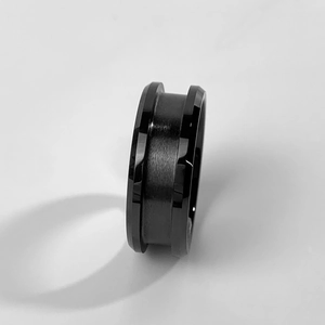 Close-up of black tungsten ring blank featuring brushed finish and polished beveled edges