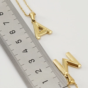 Measurement of 18K gold-plated stainless steel initial pendants showing exact size in mm