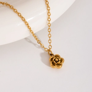 Detailed view of a golden 3D rose pendant necklace with elegant metallic finish