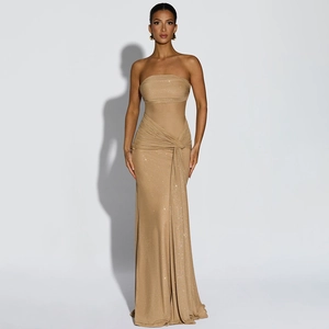 Detail of champagne gold glitter fabric with mesh patchwork and knotted waist on gown